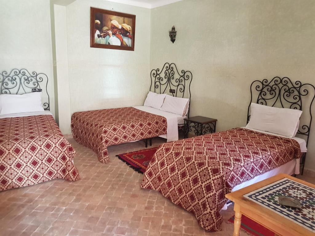 Postel nebo postele na pokoji v ubytování Hotel Wissam