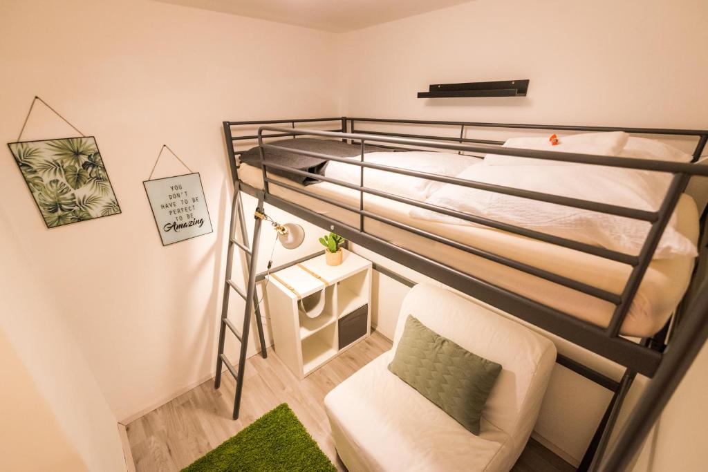 A bed or beds in a room at MOOKI Mountain & Pool Gerlitzen Apartment