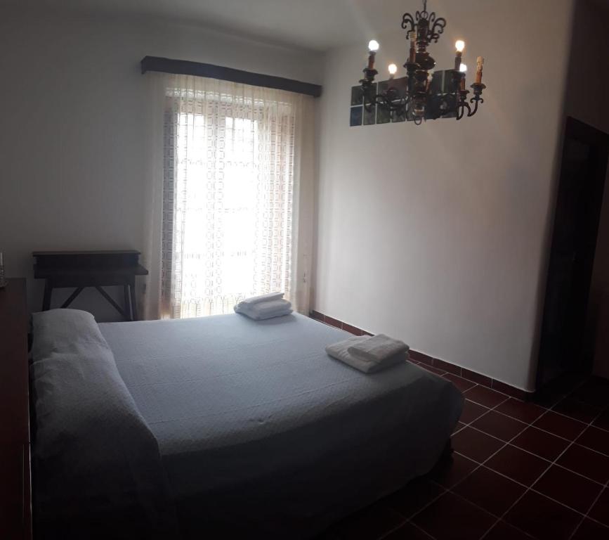 Postel nebo postele na pokoji v ubytování b&b Oikos