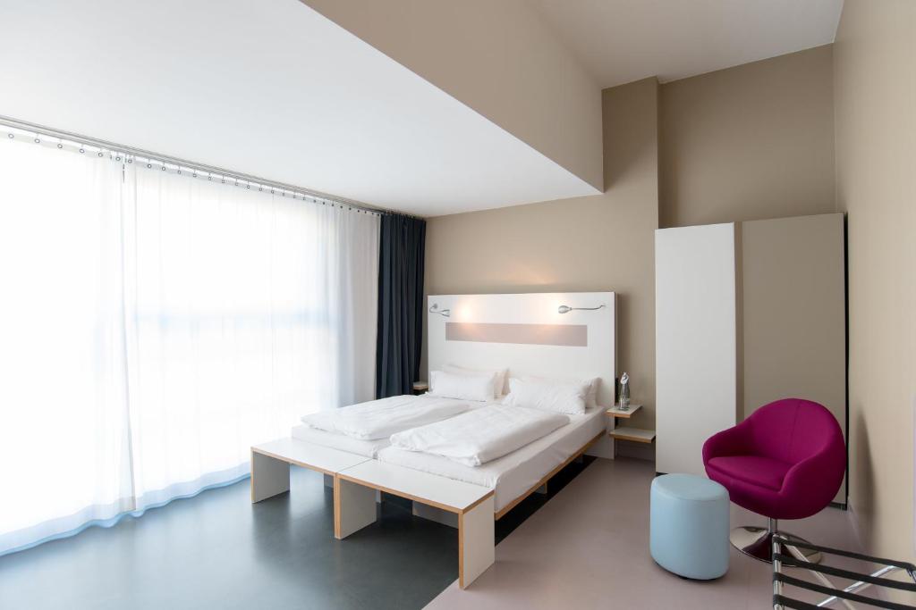 Postel nebo postele na pokoji v ubytování Ku'Damm 101 Hotel
