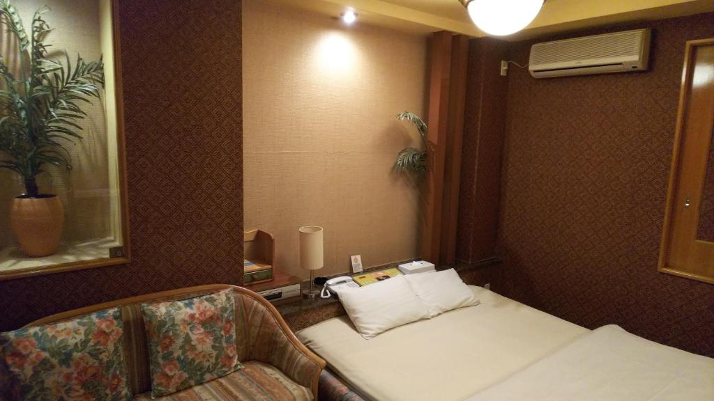 Postel nebo postele na pokoji v ubytování Hotel Essor (Adult Only)