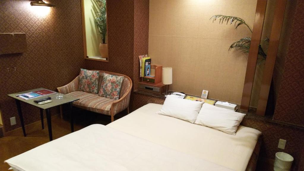 Postel nebo postele na pokoji v ubytování Hotel Essor (Adult Only)