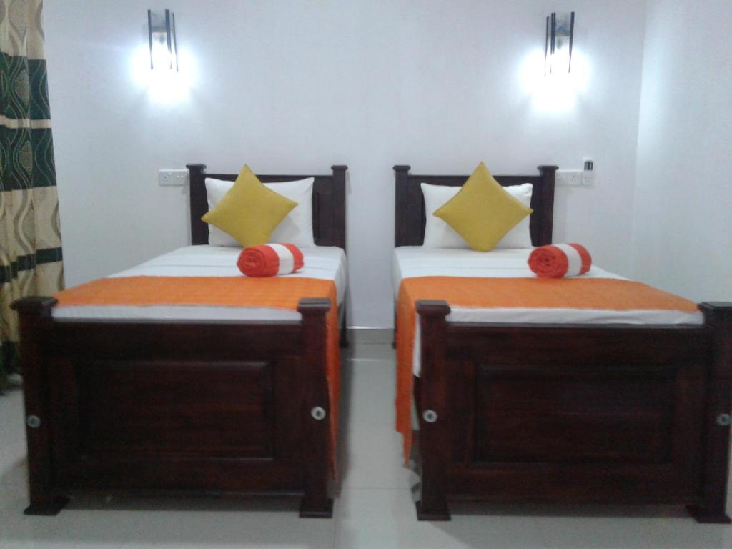 Postel nebo postele na pokoji v ubytování Habarana Dulwan Guest House