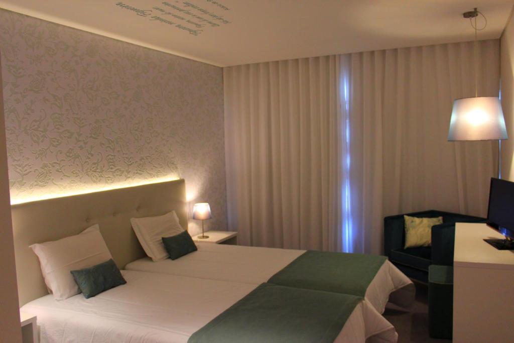 Postel nebo postele na pokoji v ubytování Costa de Prata Hotel