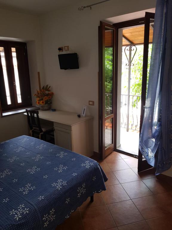 Postel nebo postele na pokoji v ubytování Locanda Aria del Re