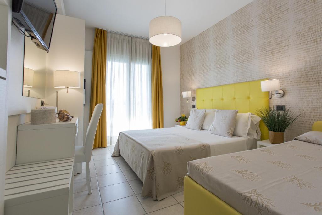 Postel nebo postele na pokoji v ubytování Hotel De Londres