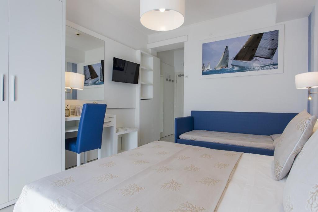 Postel nebo postele na pokoji v ubytování Hotel De Londres