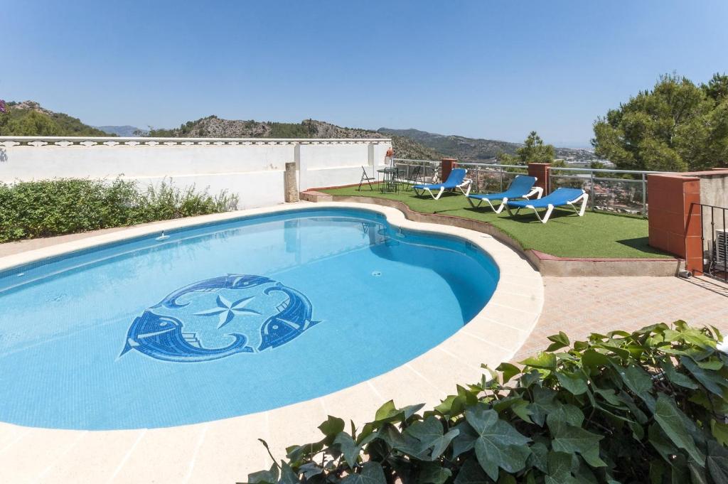 a swimming pool with a dolphin painted on it at Pedraviva in Ador