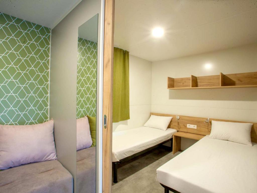Postel nebo postele na pokoji v ubytování Aurora Camping and Mobile Homes