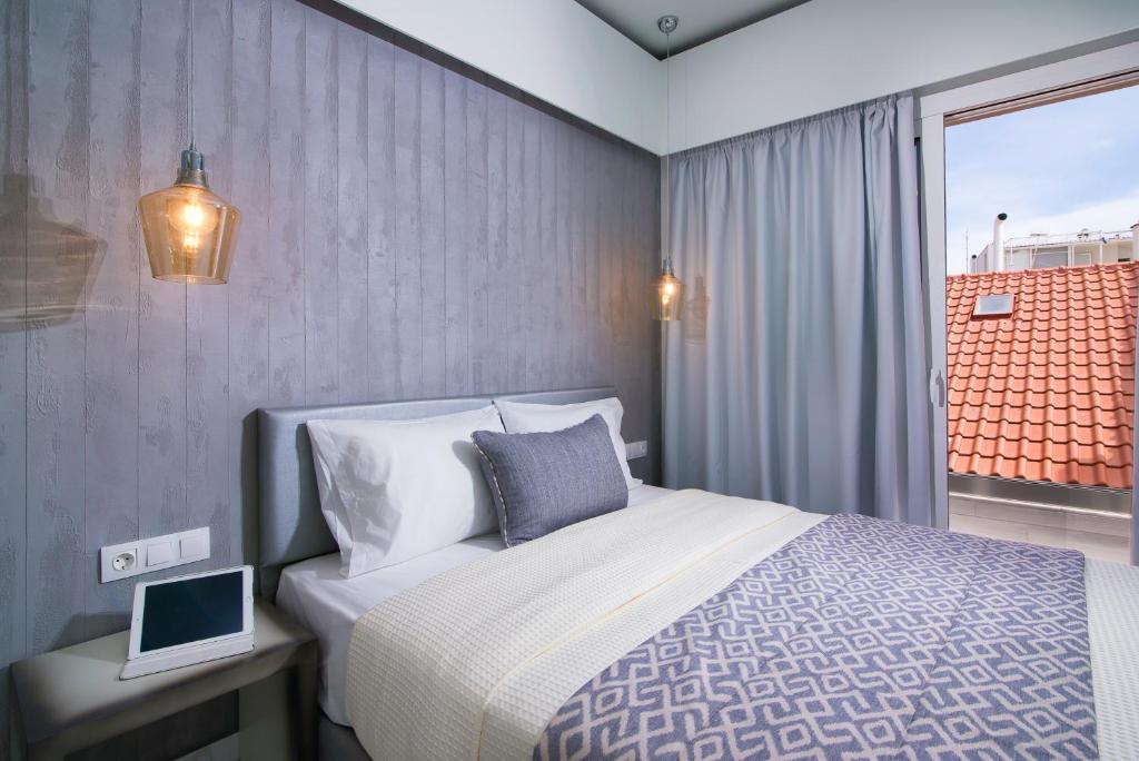 Postel nebo postele na pokoji v ubytování Molos Hotel