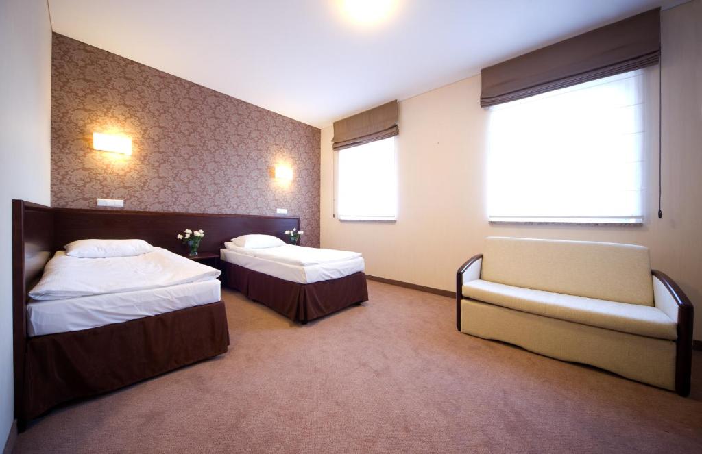 Postel nebo postele na pokoji v ubytování Hotel Centrum