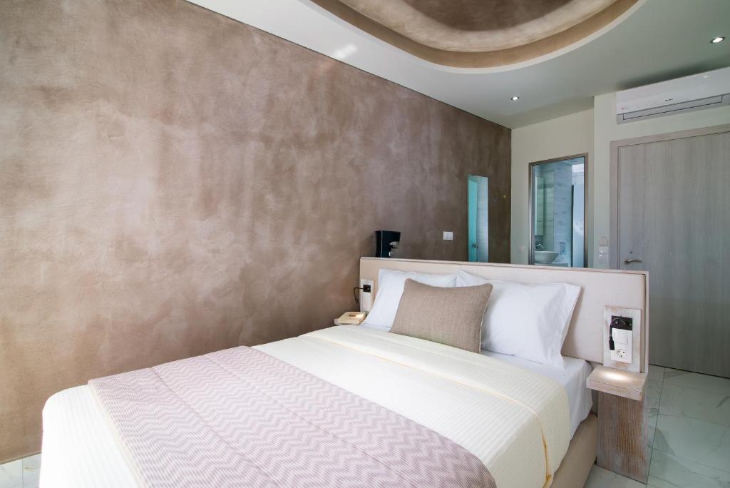 Postel nebo postele na pokoji v ubytování Molos Hotel
