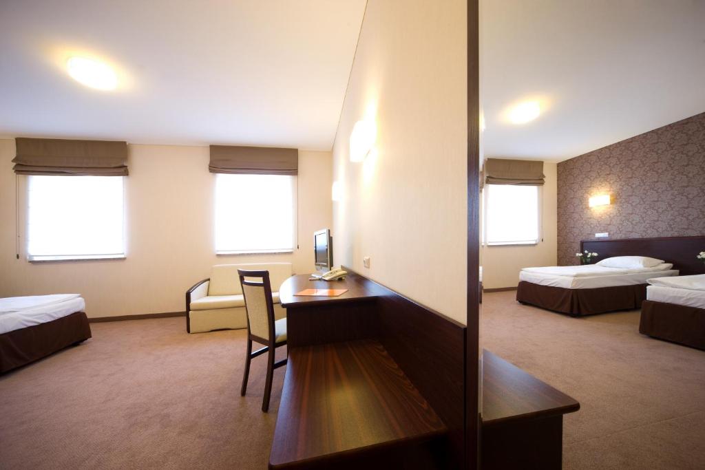 Postel nebo postele na pokoji v ubytování Hotel Centrum