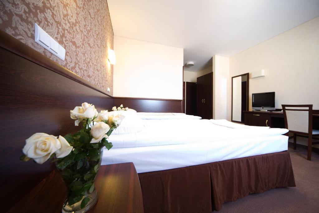 Postel nebo postele na pokoji v ubytování Hotel Centrum
