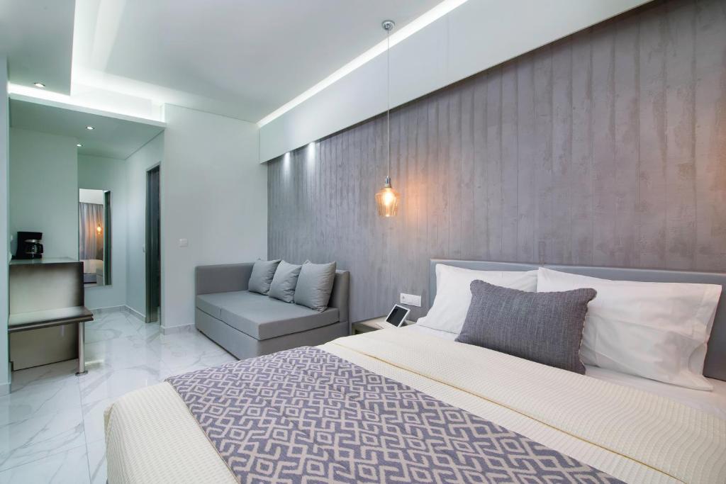 Postel nebo postele na pokoji v ubytování Molos Hotel