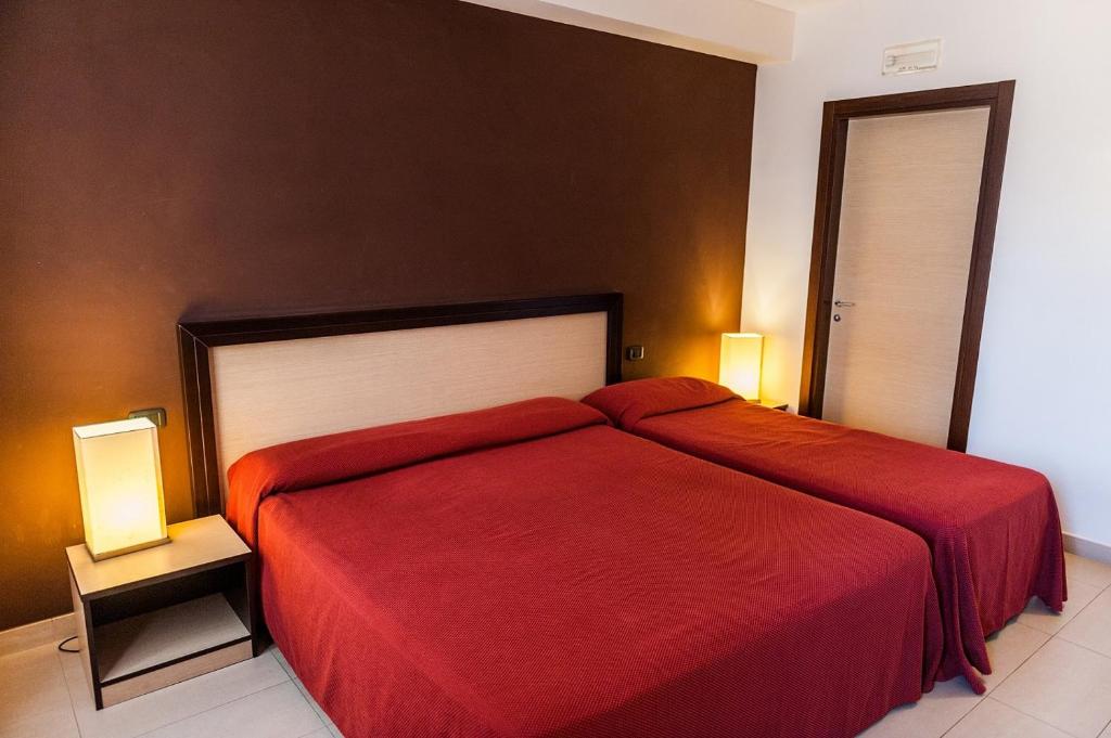 Letto o letti in una camera di Hotel Il Portico