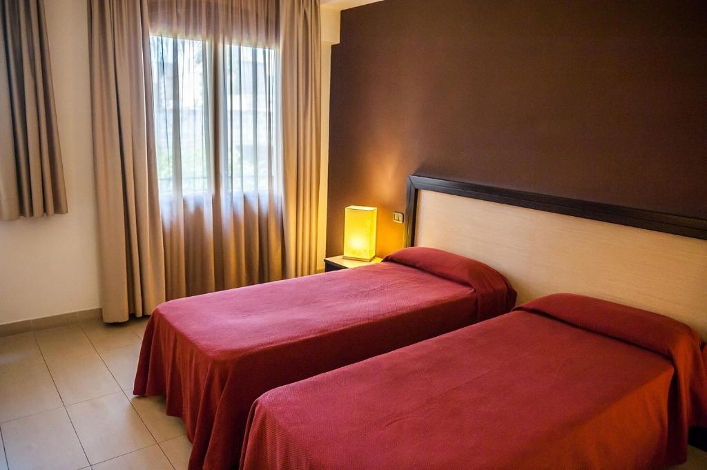 Letto o letti in una camera di Hotel Il Portico