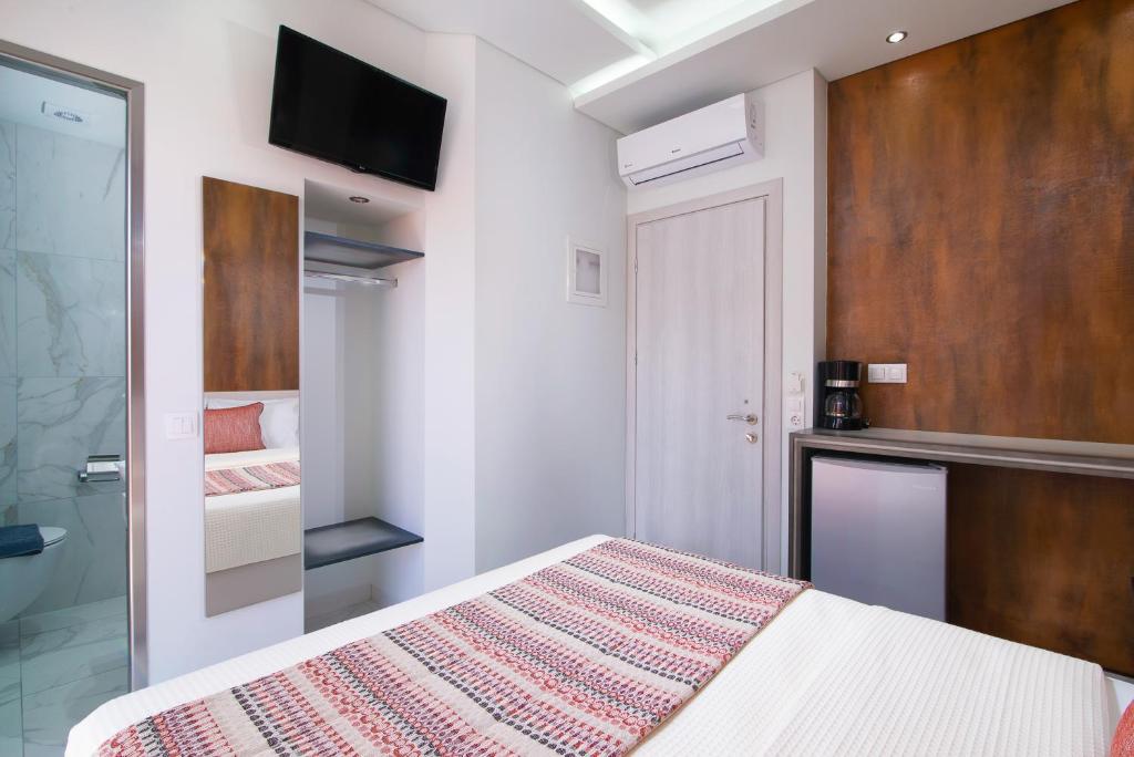 Postel nebo postele na pokoji v ubytování Molos Hotel