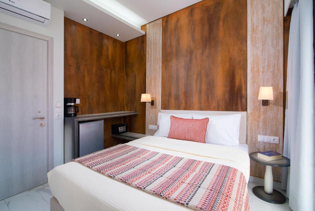 Postel nebo postele na pokoji v ubytování Molos Hotel