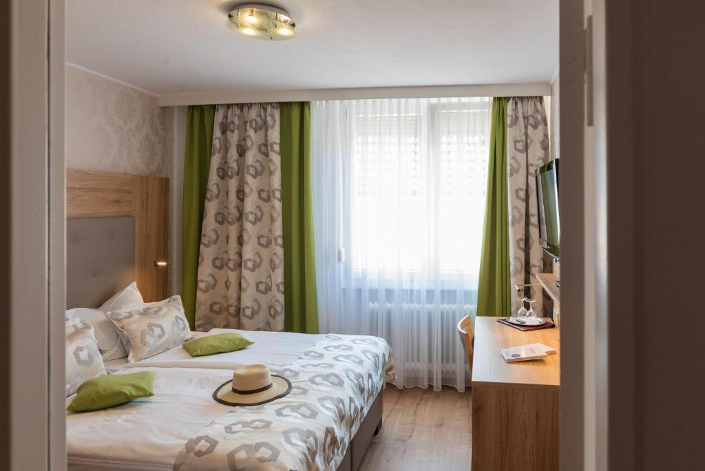 Postel nebo postele na pokoji v ubytování Central Boutique Hotel
