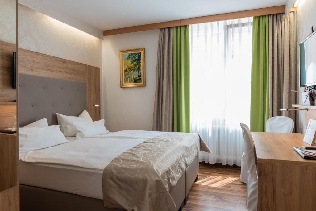 Postel nebo postele na pokoji v ubytování Central Boutique Hotel