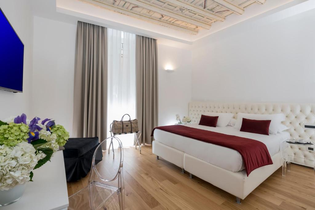 Postel nebo postele na pokoji v ubytování Hotel Navona