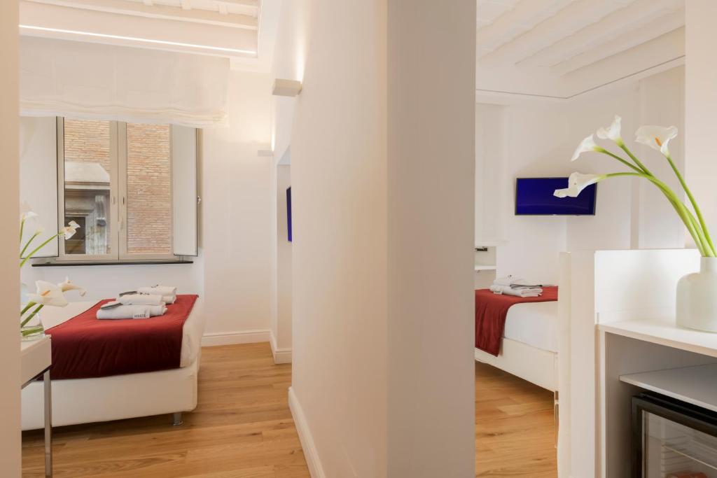 Postel nebo postele na pokoji v ubytování Hotel Navona