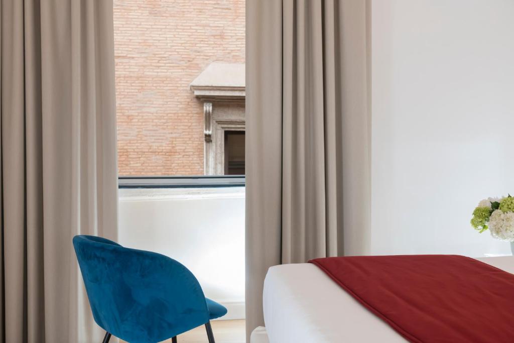 Postel nebo postele na pokoji v ubytování Hotel Navona