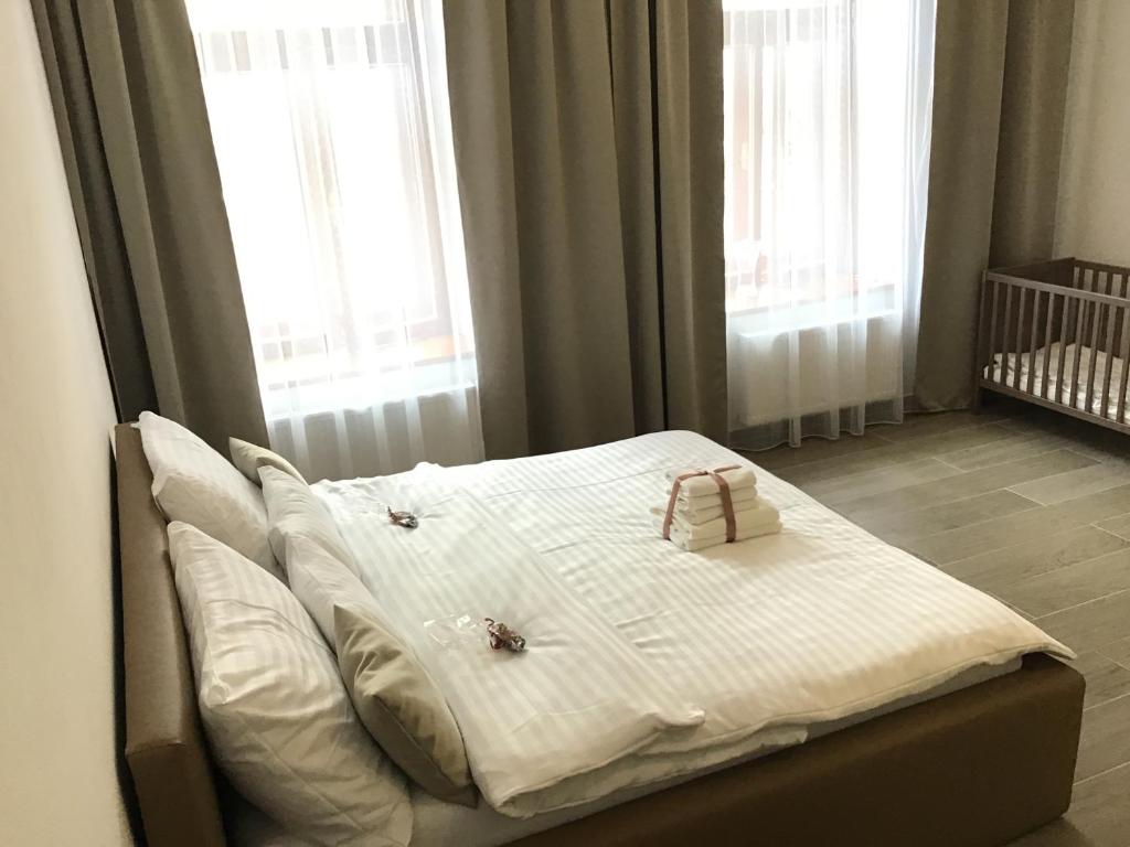 Postel nebo postele na pokoji v ubytování EURO APARTMENTS LIDICKÁ 39 BRNO