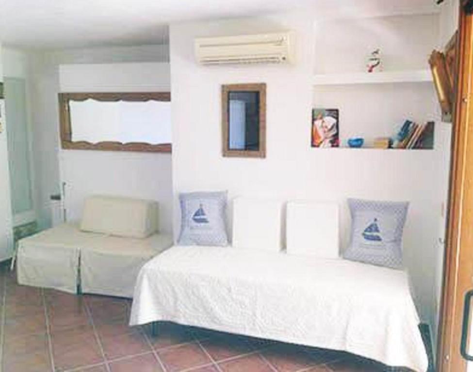 Postel nebo postele na pokoji v ubytování Lulamax Sardegna