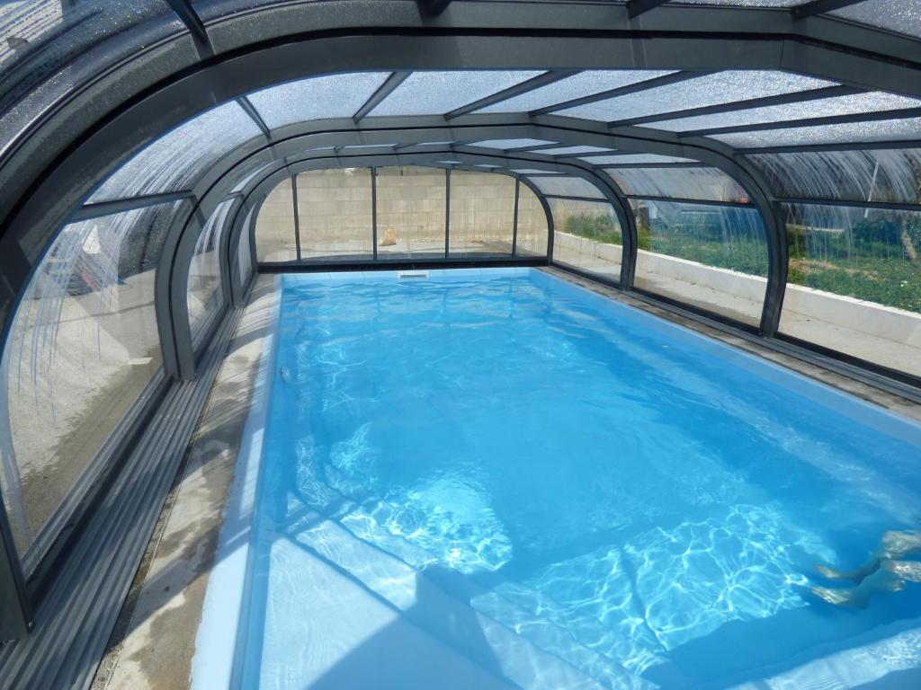 an overhead view of an indoor swimming pool with an archway at Le Chêne Liège in Maché