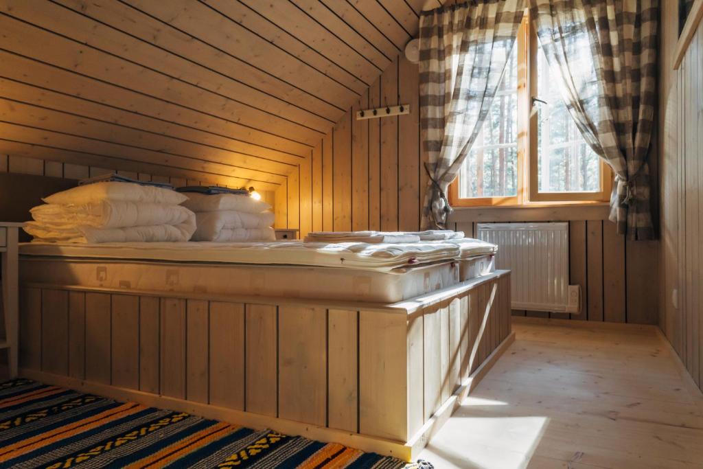 Postel nebo postele na pokoji v ubytování Peipsi Homestay