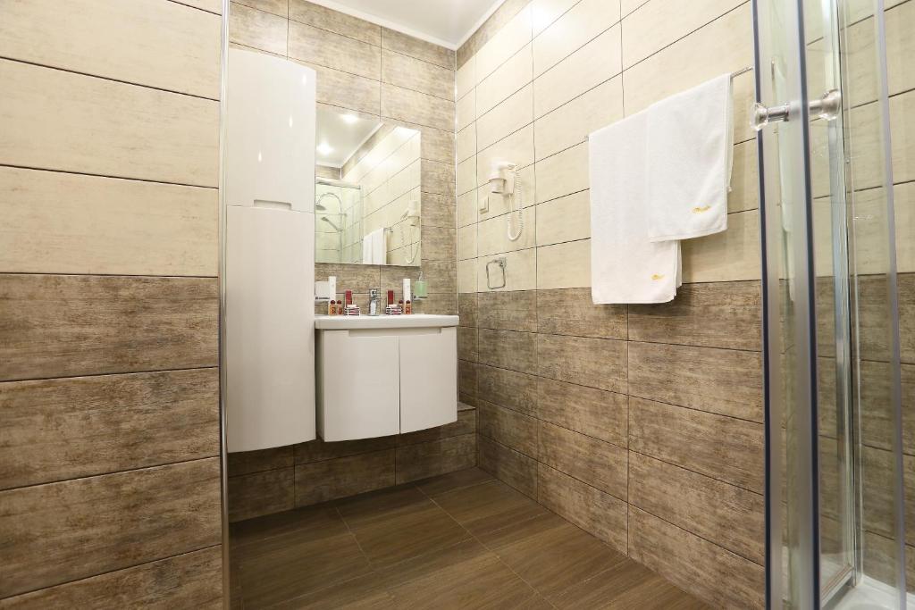 Koupelna v ubytování Oberig Hotel