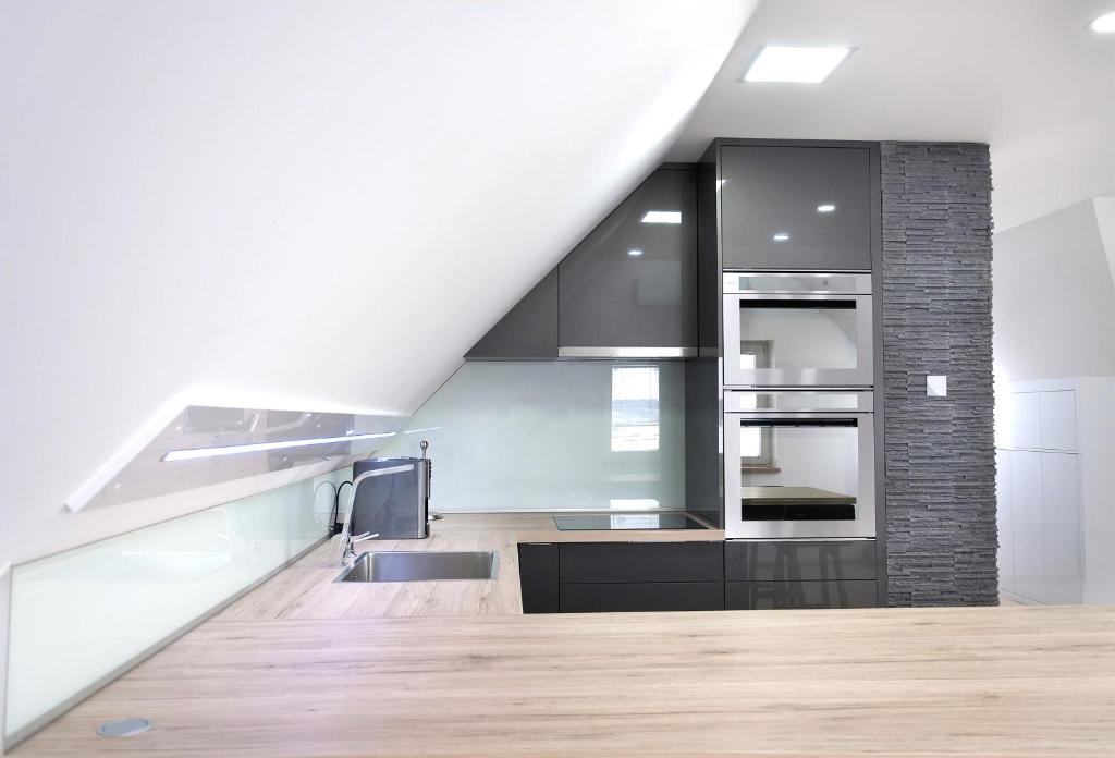 A kitchen or kitchenette at Shambala Apartman Tihany