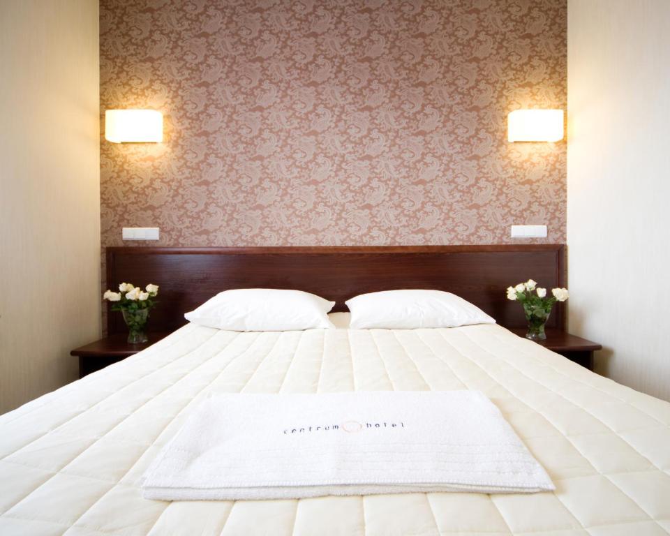 Postel nebo postele na pokoji v ubytování Hotel Centrum