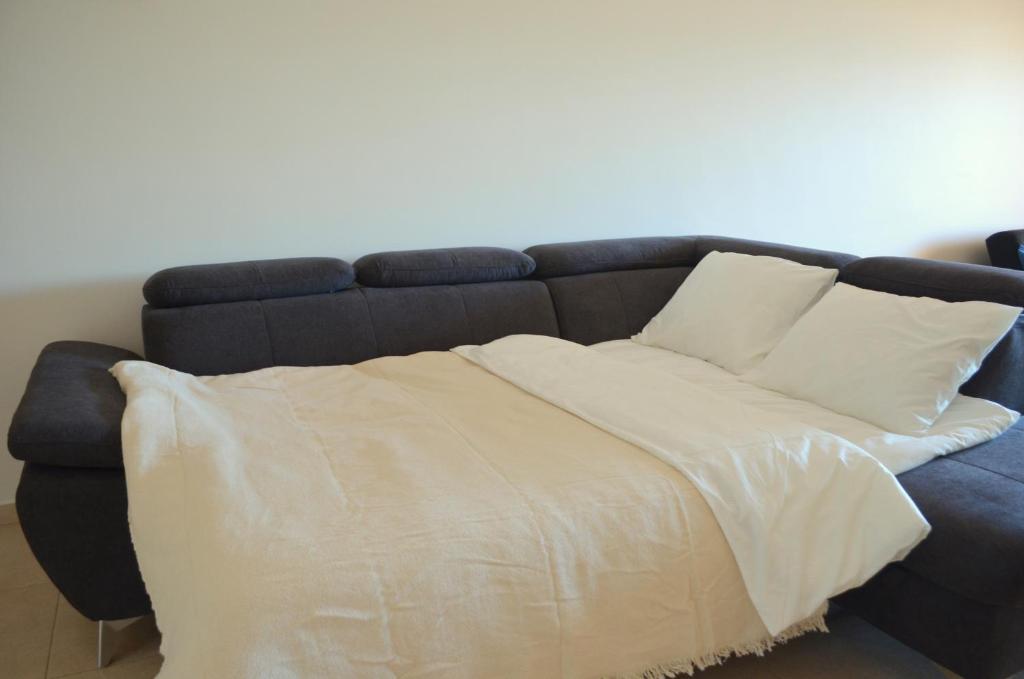 Postel nebo postele na pokoji v ubytování Marina Beach Apartment