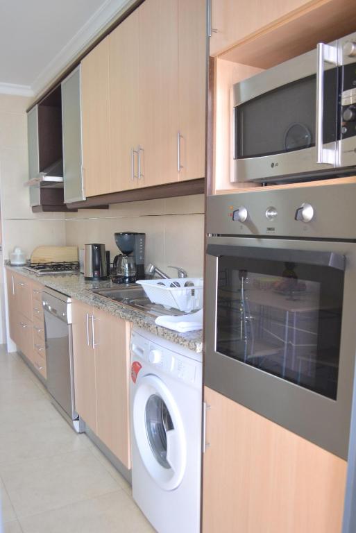 Kuchyň nebo kuchyňský kout v ubytování Marina Beach Apartment