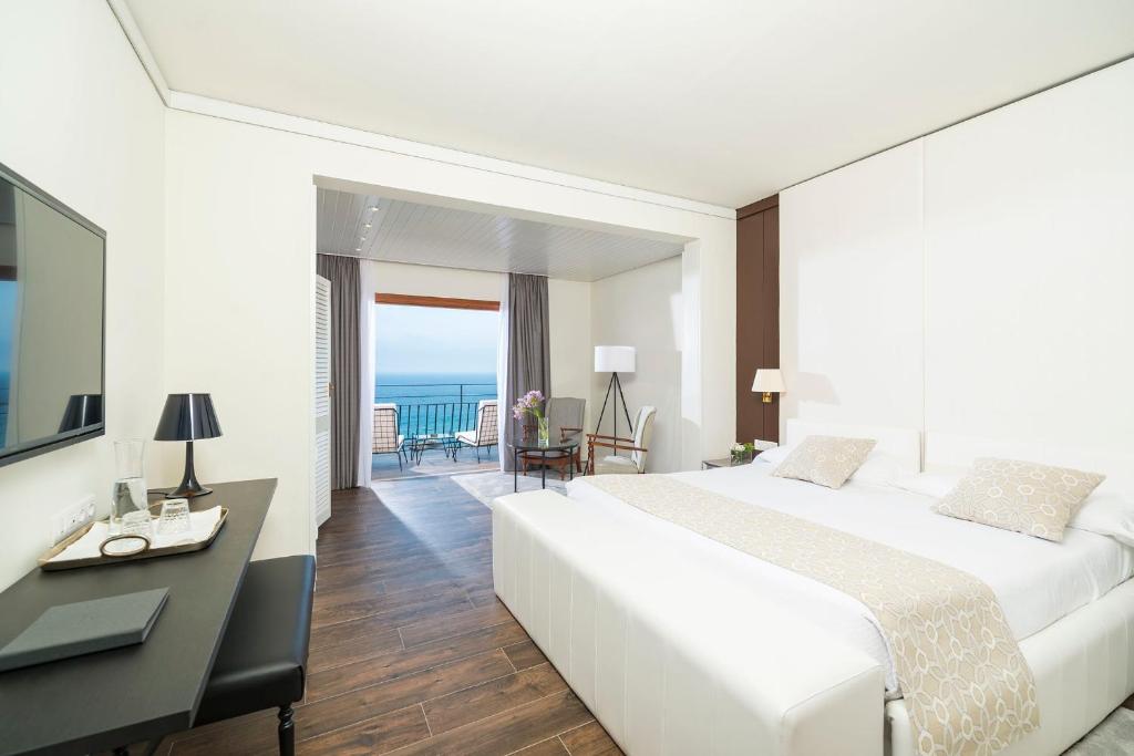 Llit o llits en una habitació de Hotel Santa Marta