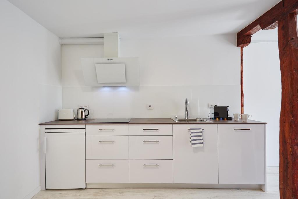 Kuchyň nebo kuchyňský kout v ubytování LEEWAYS LOFT in PELAYO