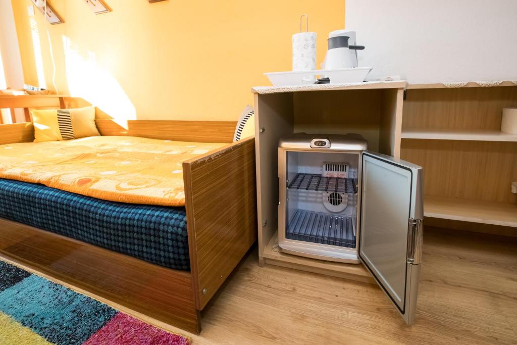 Postel nebo postele na pokoji v ubytování Apartments and Rooms Ražen