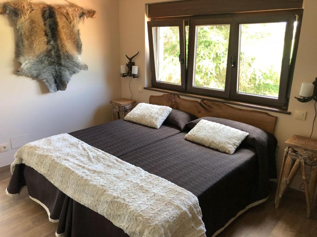 Postel nebo postele na pokoji v ubytování Las Cavernas Del Bisonte