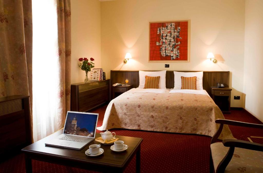 Postel nebo postele na pokoji v ubytování Hotel Continental