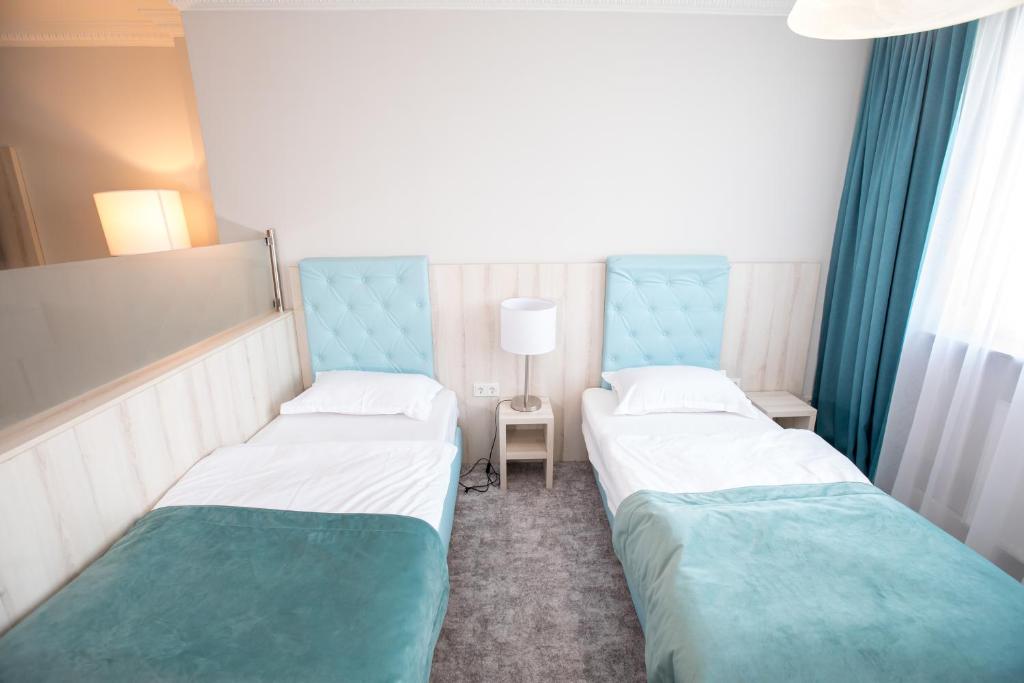 Postel nebo postele na pokoji v ubytování Hotel Amts-Apotheke