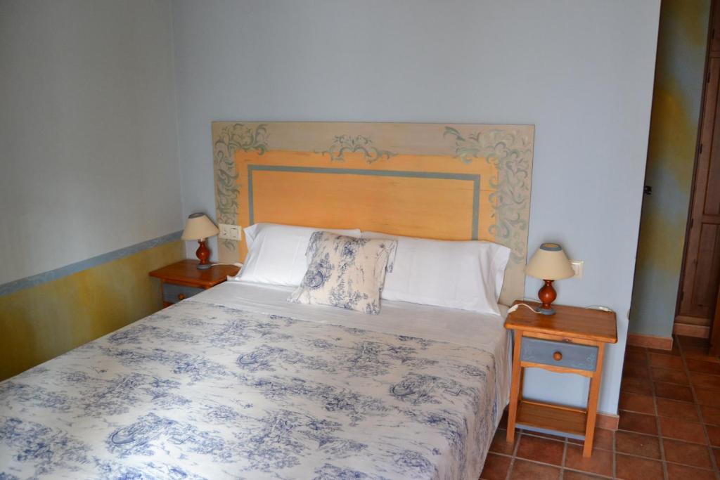 Posteľ alebo postele v izbe v ubytovaní Hostal Toribio
