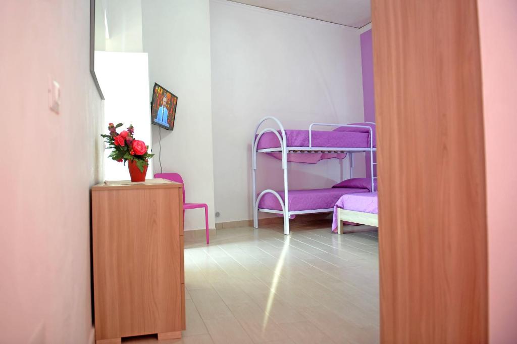 A bed or beds in a room at casa vacanze"IL TRAMONTO"