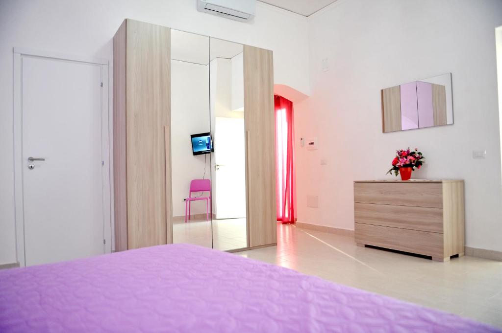 A bed or beds in a room at casa vacanze"IL TRAMONTO"