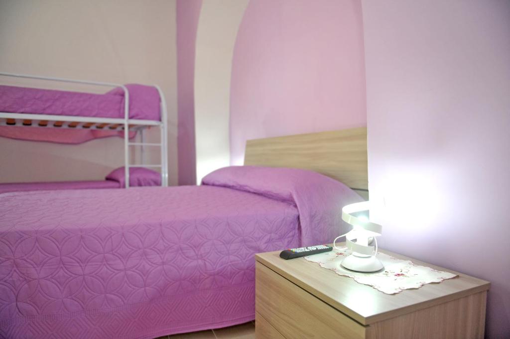 A bed or beds in a room at casa vacanze"IL TRAMONTO"