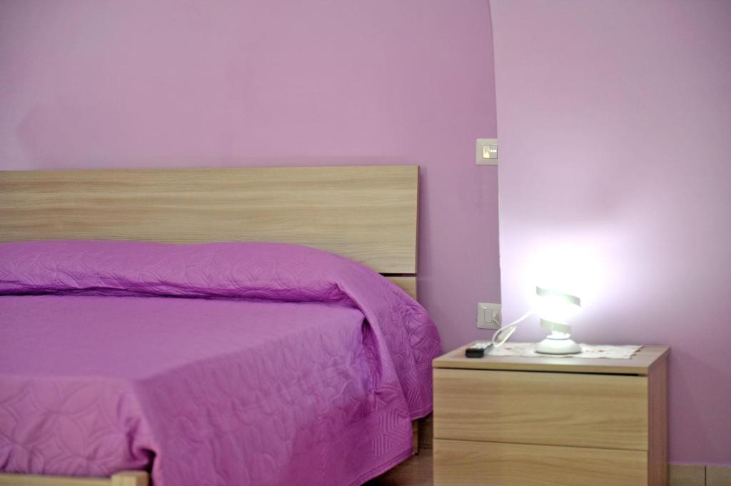 A bed or beds in a room at casa vacanze"IL TRAMONTO"