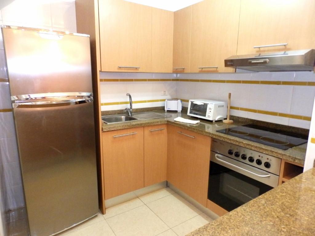 Kuchyň nebo kuchyňský kout v ubytování Apartamentos Medano - La Ladera