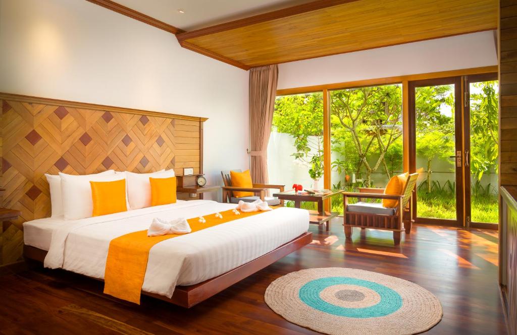 Postel nebo postele na pokoji v ubytování Khmer House Resort